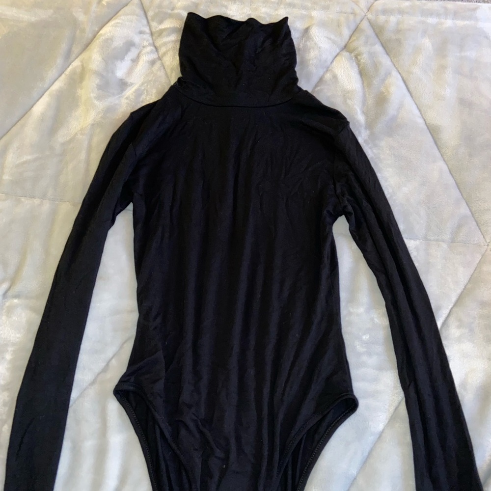 Black turtle neck body suit